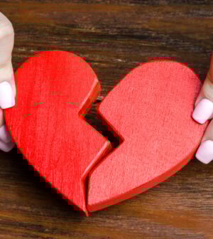 A woman collects a broken heart in his hands