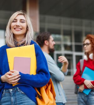Cheerful young woman applying to university