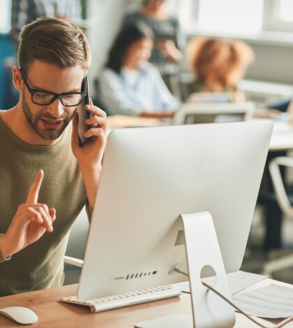 Patient call-center operator gesturing during a phone-call