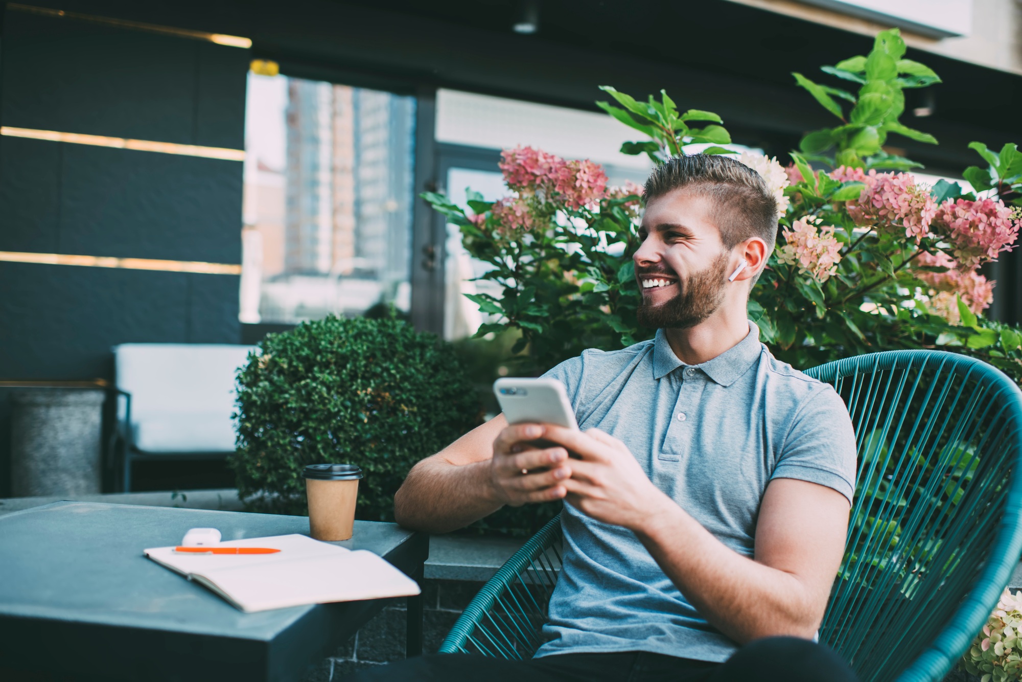 Satisfied man text messaging on smartphone