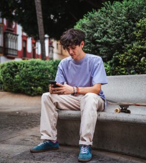 Skater man sending a text message